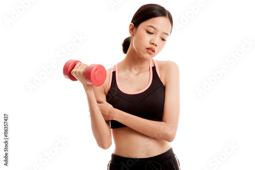 Asian healthy girl got arm pain with dumbbell isolated on white background