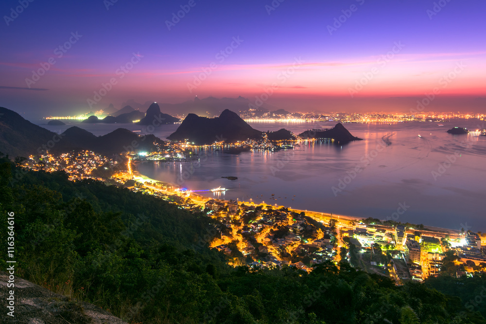 Night view of Rio de Janeiro in the horizon after the sunset from the City Park in Niteroi, Brazil