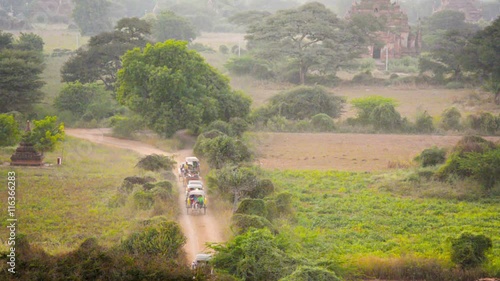 Video 1920x1080 - Traffic jam on a dirt road. Horse carriages carryng tourists to hotels. Myanmar, Bagan photo