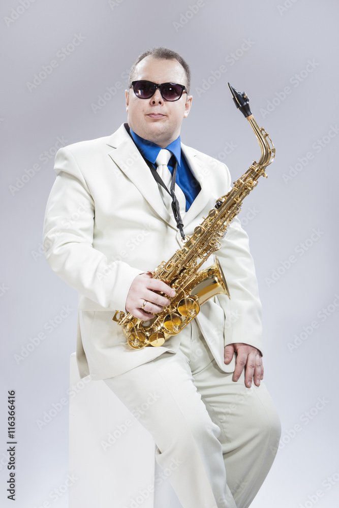 Fototapeta premium Music Concept and Ideas. Handsome Caucasian Musician With Alto Saxo