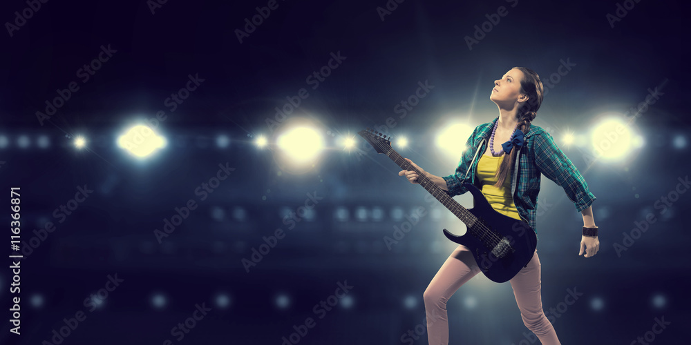 Female rock guitarist .  Mixed media