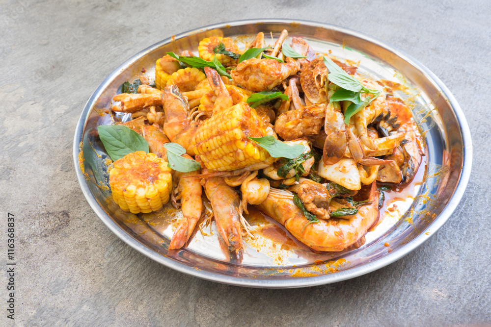 Fried shrimp ,squid and crab with basil with hot and spicy sour Fried shrimp ,squid and crab with basil with hot and spicy sour