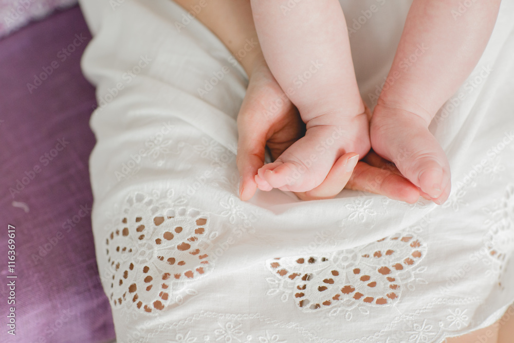 Baby feet in mommy's hands Baby feet in mommy's hands
