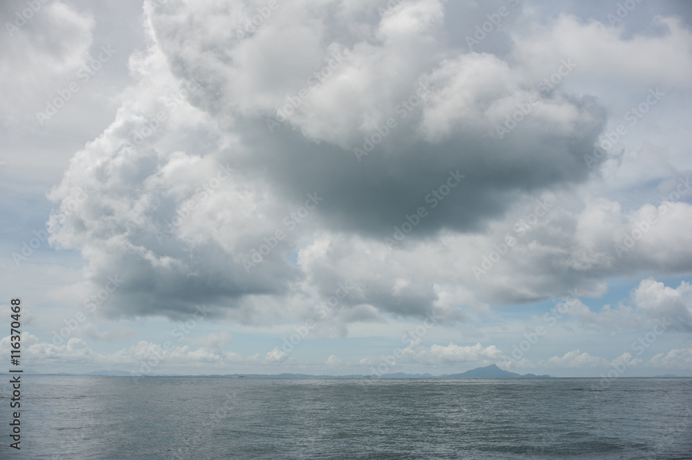 The sun higher than rain cloud over the sea. Krabi, Thailand. The sun higher than rain cloud over the sea. Krabi, Thailand.