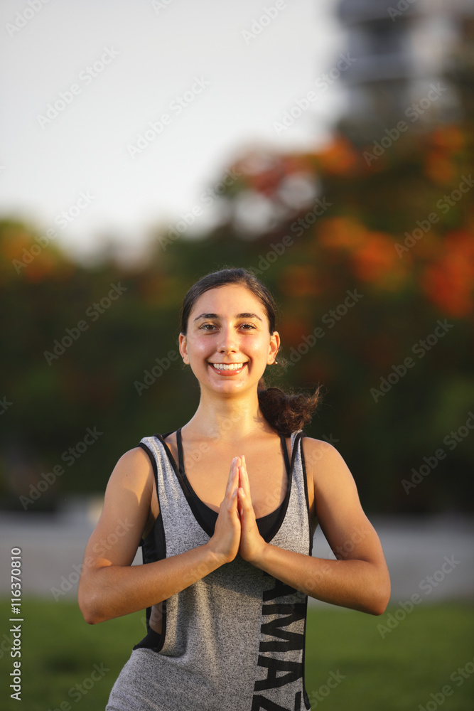 Fit woman performing yoga in the park Fit woman performing yoga in the park