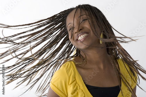 Принти на полотні Young African woman dancing, isolated on white