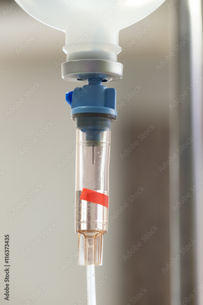 Close up saline IV drip for patient and Infusion pump in hospita Close up saline IV drip for patient and Infusion pump in hospita