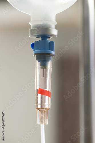 Close up saline IV drip for patient and Infusion pump in hospita