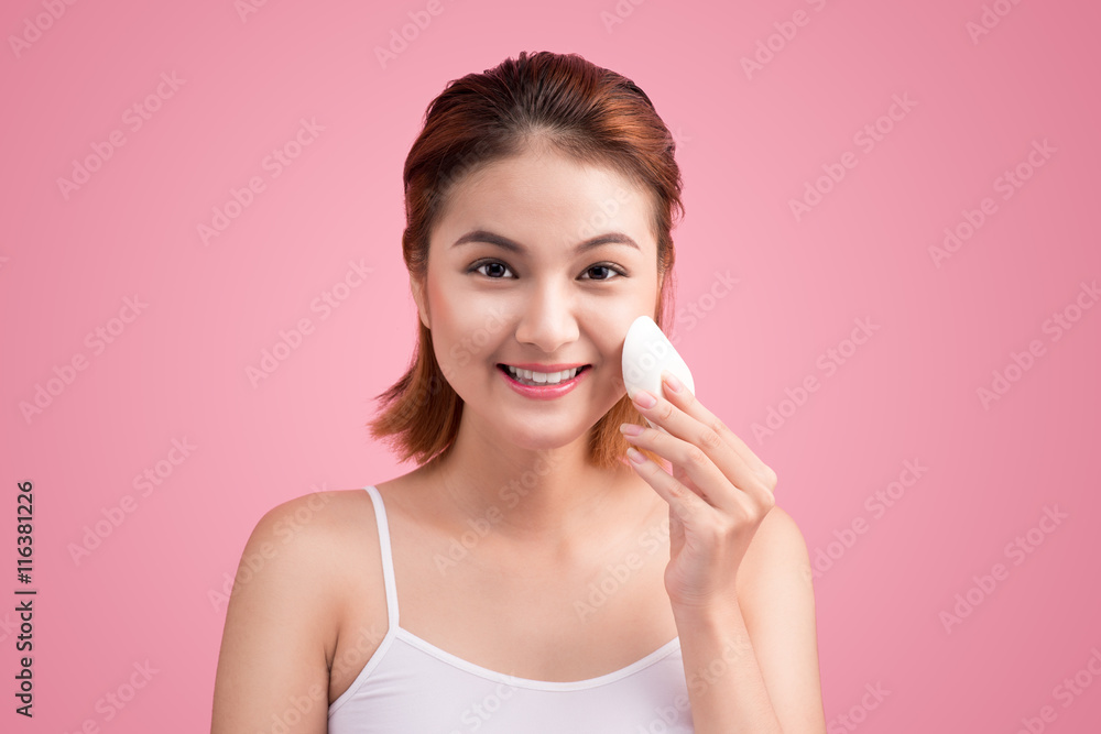 Beauty face of young woman with cosmetic cream on a cheek. Skin Beauty face of young woman with cosmetic cream on a cheek. Skin