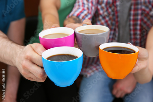 People holding coffee cups