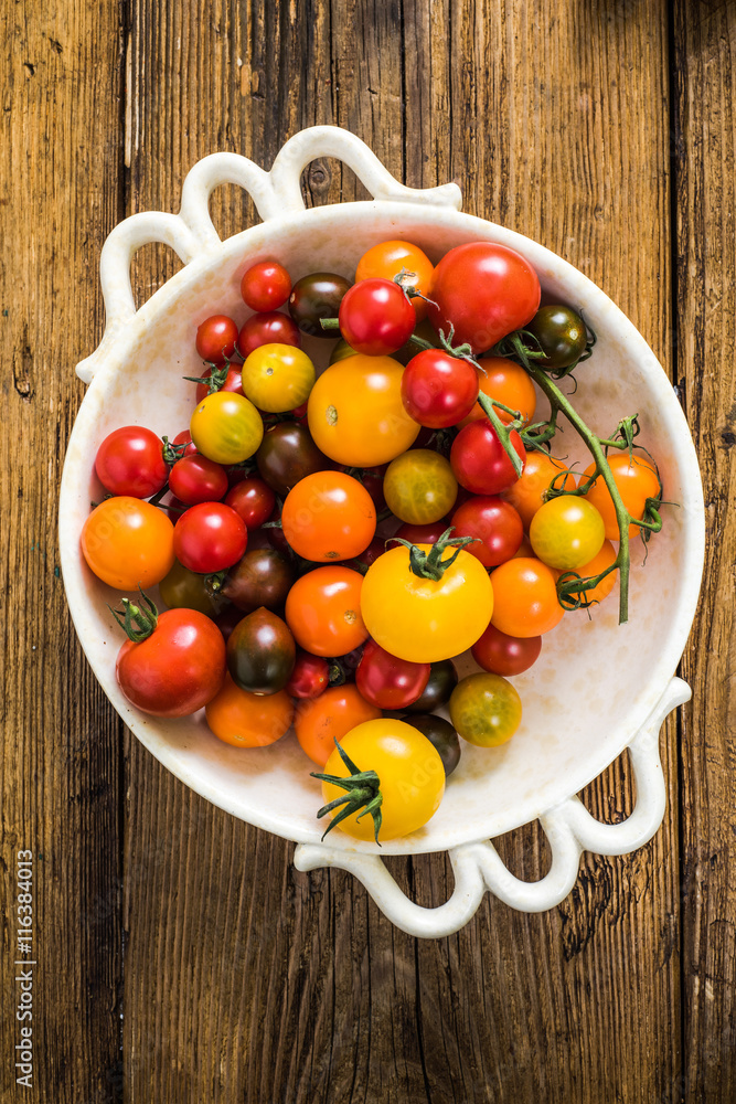 selection of tomatoes in rustic bowl selection of tomatoes in rustic bowl