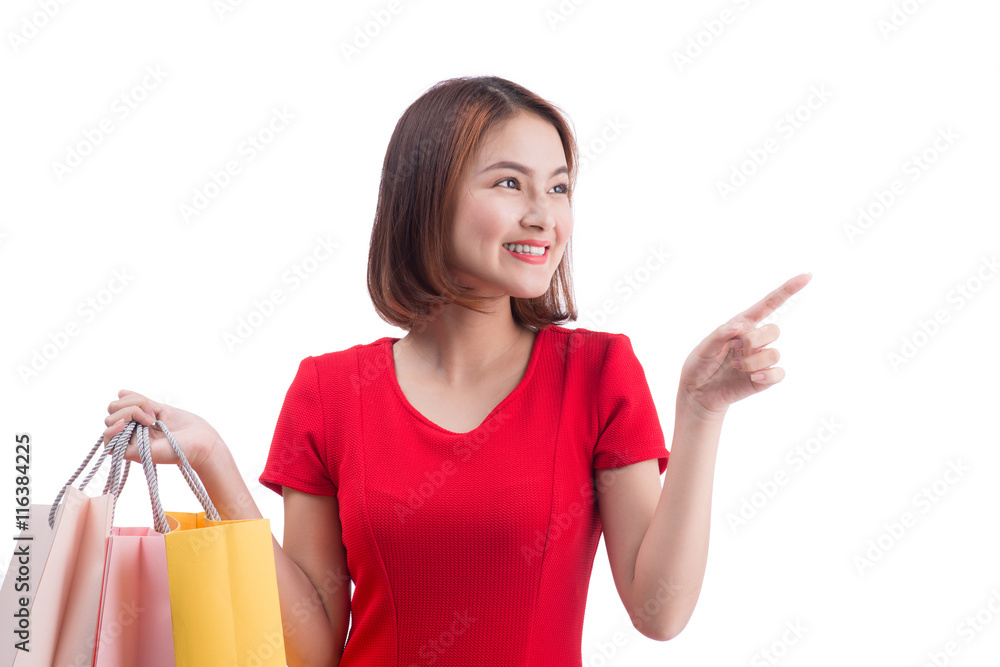 Shopping woman smiling joyful and happy holding shopping bags po Shopping woman smiling joyful and happy holding shopping bags po