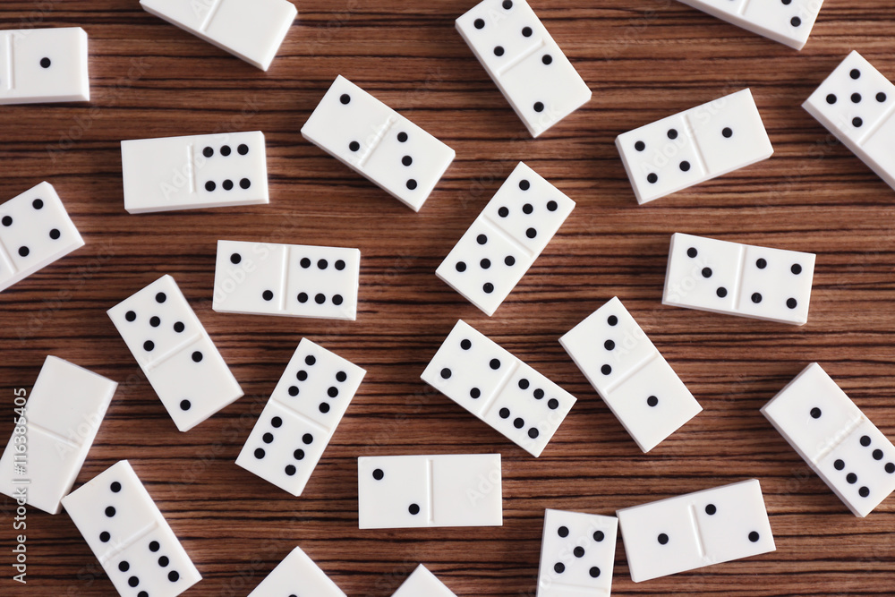 Heap of dominoes on wooden background Heap of dominoes on wooden background