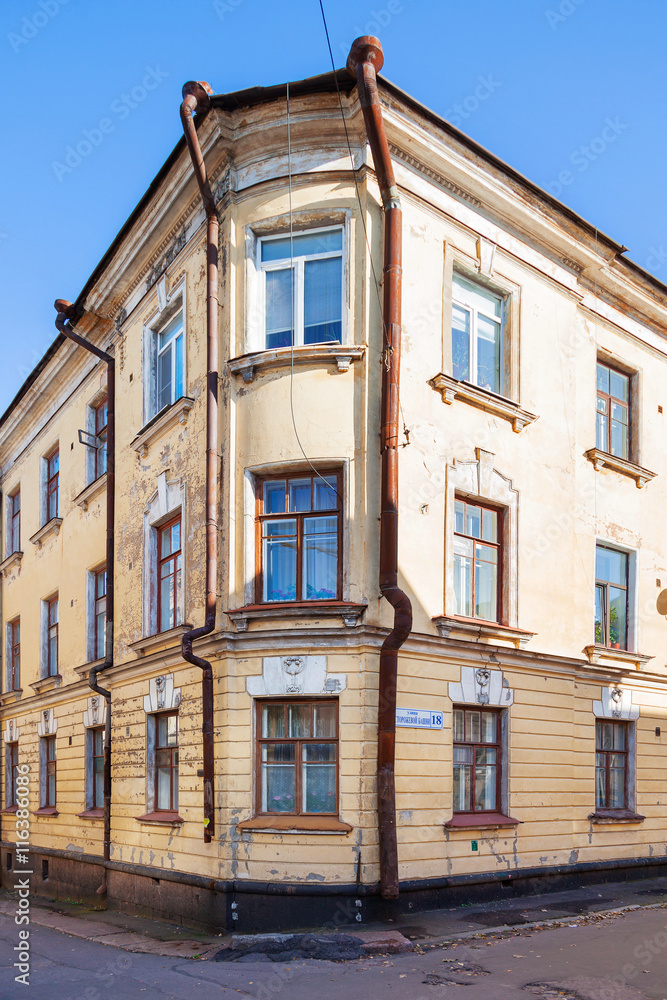 Old house in Vyborg, Russia. Building with old fashioned windows and down pipes.