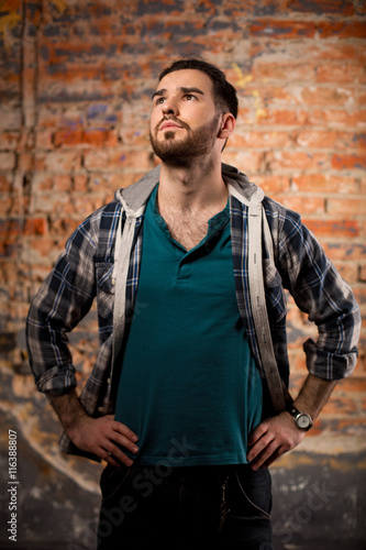 Hipster style. Attractive man in studio