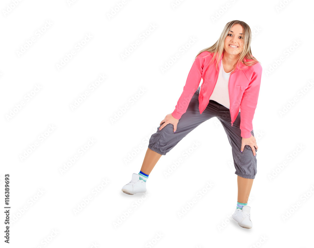 Young smiling woman in sportwear isolated over white