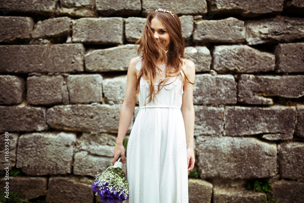 Bride looks stunning being half-hidden behind her hair Bride looks stunning being half-hidden behind her hair