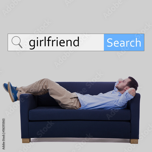 internet and online dating concept - search bar and man lying on photo