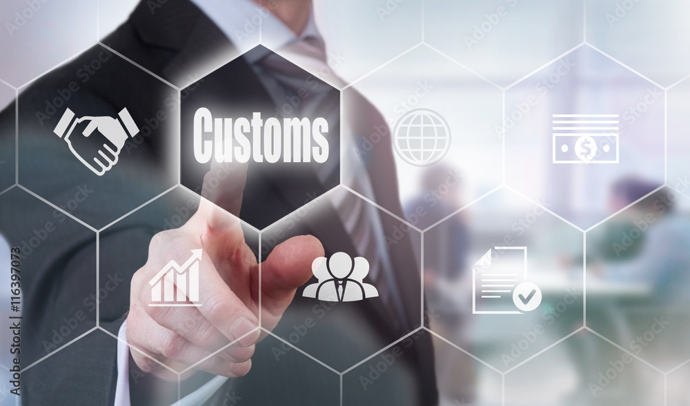 A businessman selecting a Customs Concept button on a hexagonal screen