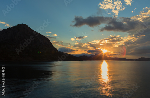 Beautiful sunrise in the Blue Bay near village Novyi Svit. Crimea.