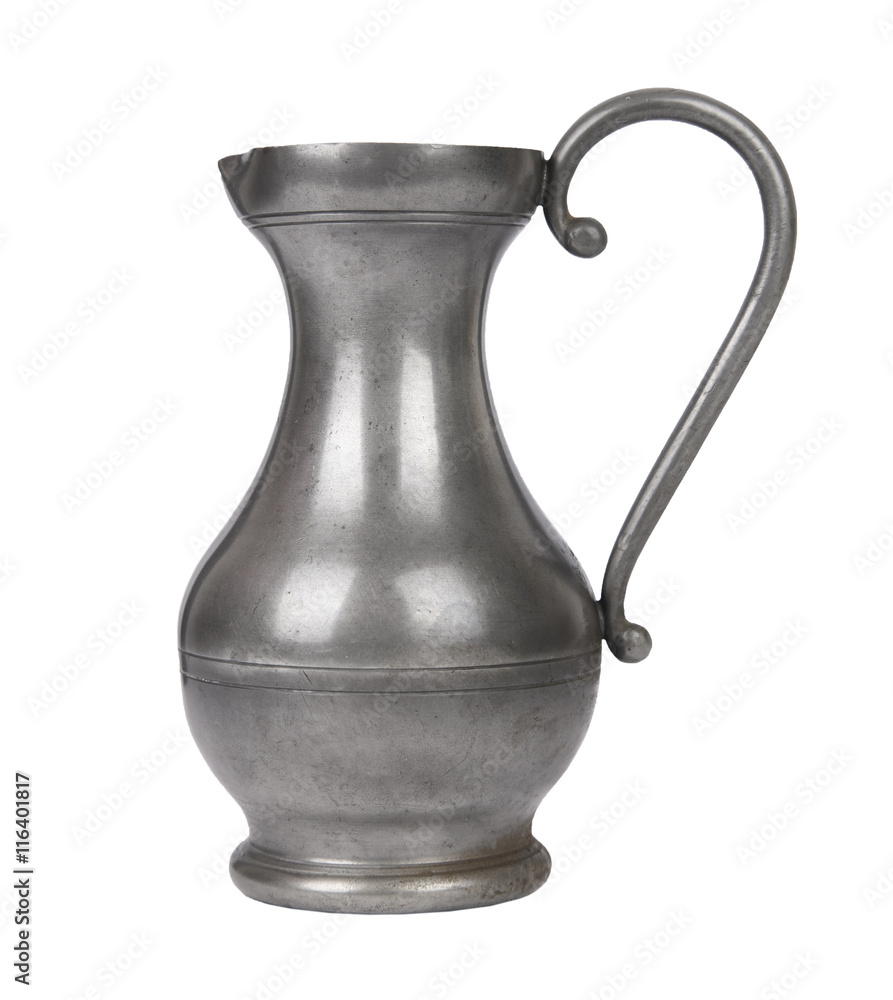 Antique silver colored pewter water jug isolated on a white background