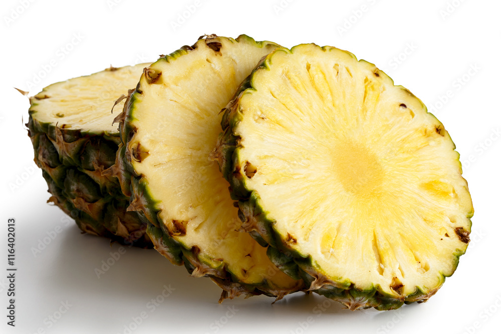 Round pineapple slices with skin isolated on white. Round pineapple slices with skin isolated on white.