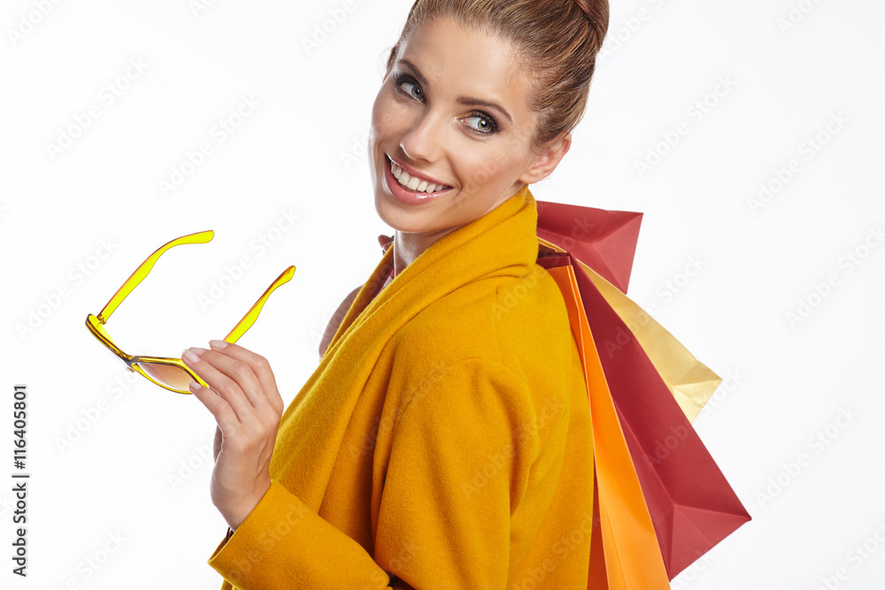 Autumn  woman with shopping bags over white background
