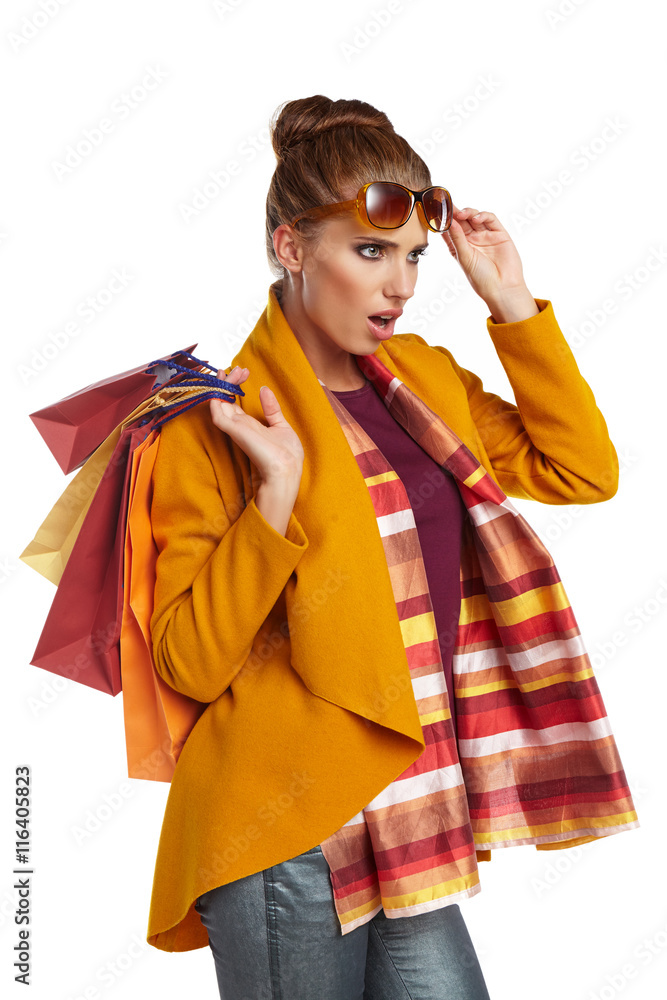 © ZoomTeam - Autumn  woman with shopping bags over white background