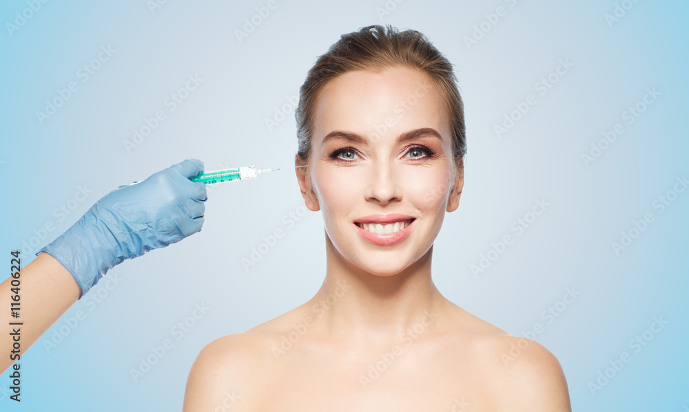 woman face and hand with syringe making injection