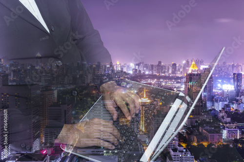 double exposure of business man and cityscape