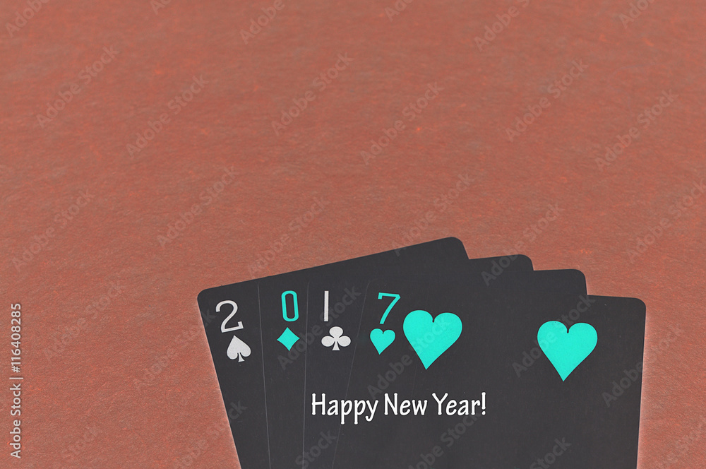 Obraz premium 2017 made out of playing cards with the words happy new year written on it with an invert effect on the photo