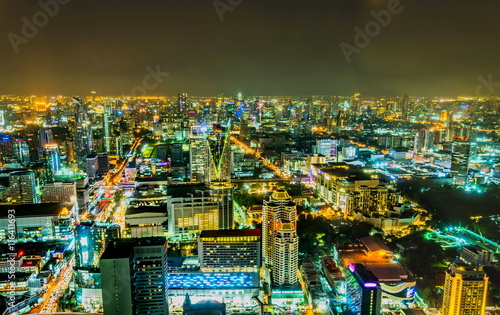 view over the big asian city of Bangkok , Thailand at nighttime when the tall skyscrapers are illuminated © khlongwangchao