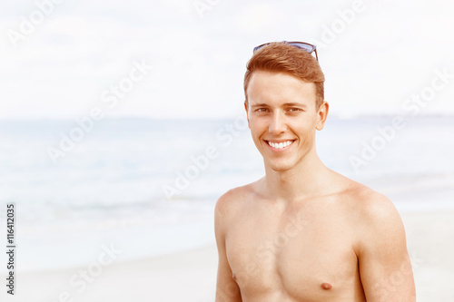 Handsome man posing at beach