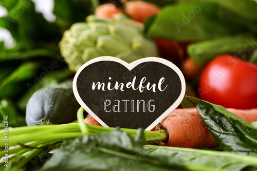 Fotobehang raw vegetables and text mindful eating