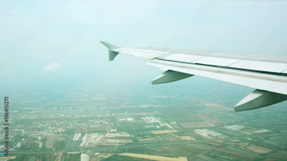 1920x1080 video - Views of fields and villages under the wing of an airplane 1920x1080 video - Views of fields and villages under the wing of an airplane