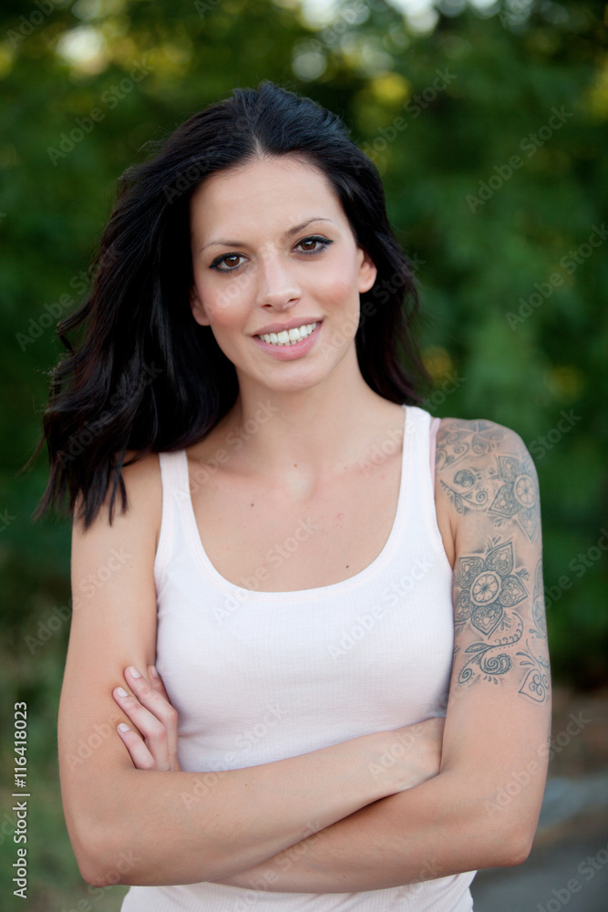 Beautiful brunette girl relaxing in the park Beautiful brunette girl relaxing in the park