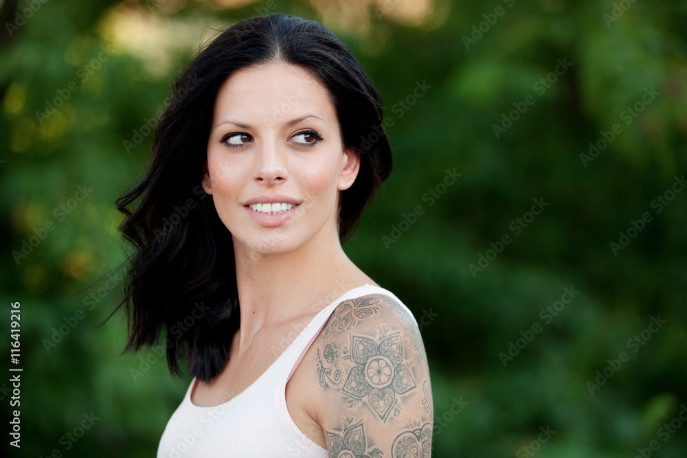 Beautiful brunette girl relaxing in the park Beautiful brunette girl relaxing in the park