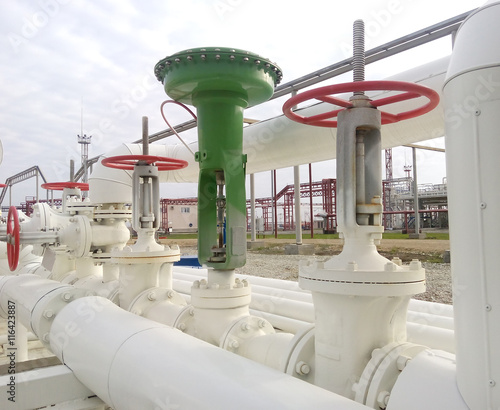 Green pneumatic valve on the pipeline photo