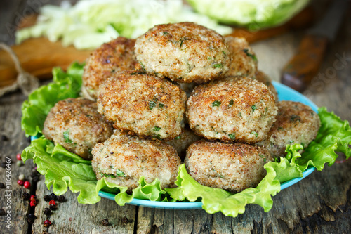 Cutlets of pork with cabbage and green herbs