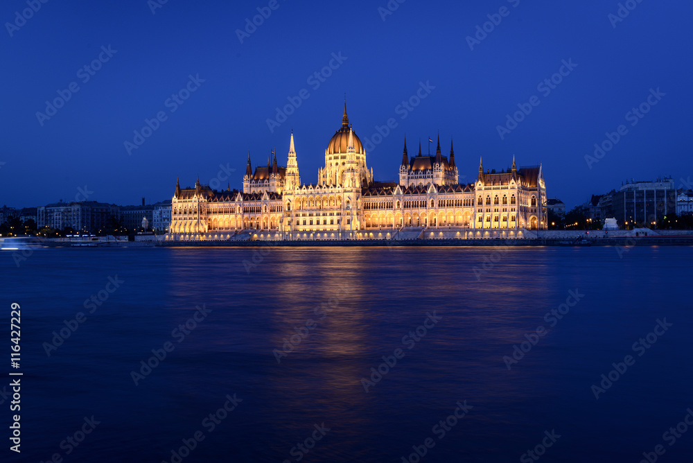 The Hungarian Parliament Building close to Danube river at night.