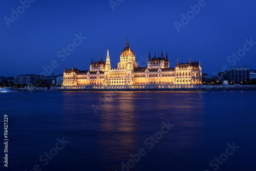 The Hungarian Parliament Building close to Danube river at night. © dannywilde