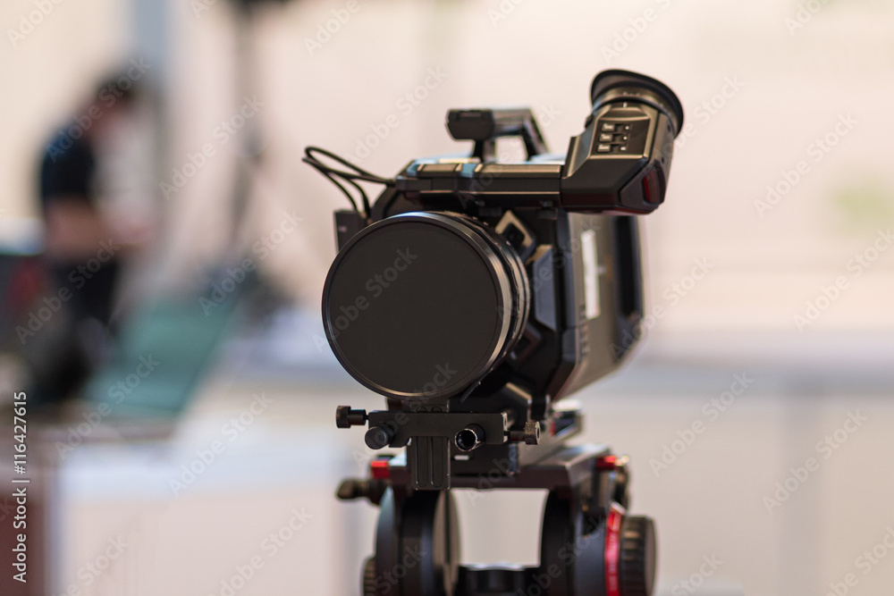 Video camera on a tripod and a blurred background Video camera on a tripod and a blurred background