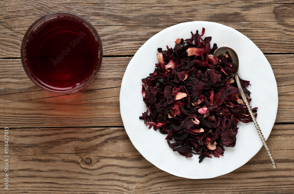 cup of tea Hibiscus and Hibiscus leaves on a plate cup of tea Hibiscus and Hibiscus leaves on a plate