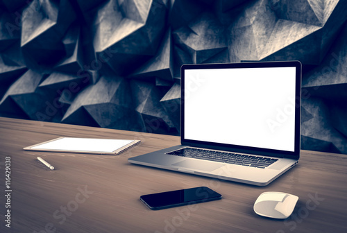 Laptop, smartphone, tablet in modern concrete interior. Template, mockup.