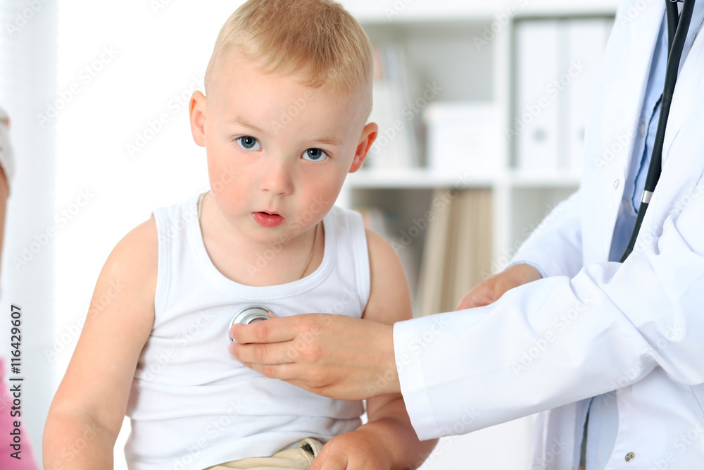 Doctor examining a child patient by stethoscope Doctor examining a child patient by stethoscope