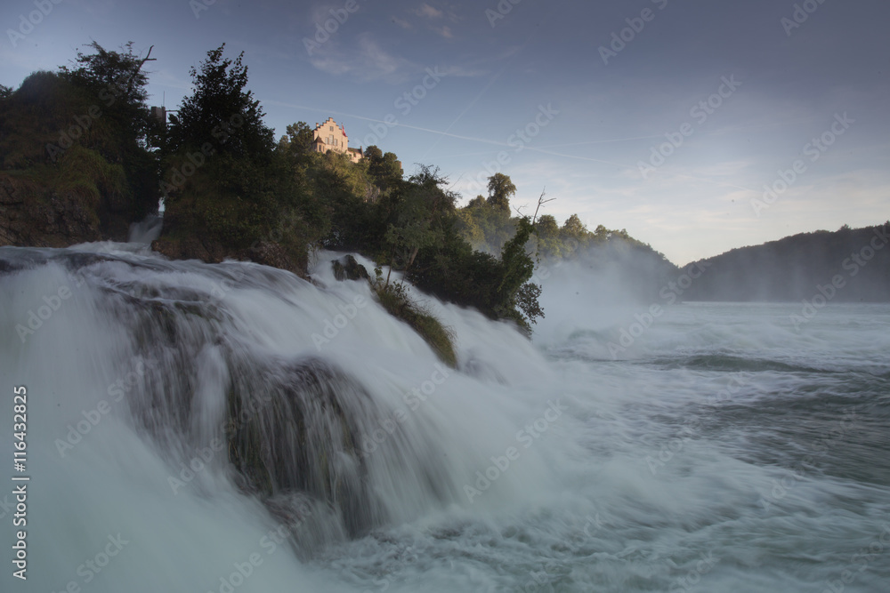 Rheinfall and the castle Laufen. The largest Europian waterfall during a summer sunset. Swizerland.