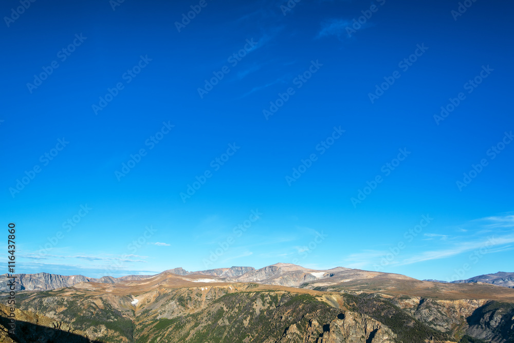 View of the Beartooth Mountains in Montana with sky in the top two thirds of the picture