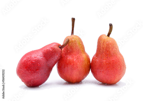 Red pear with water drops isolated on white background