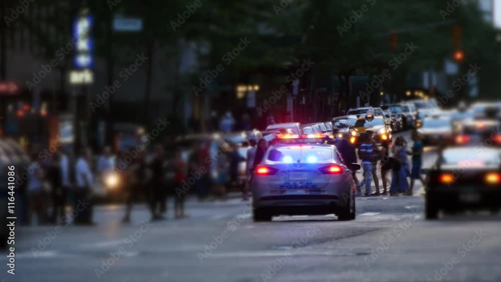 NYPD police cars chasing trough the streets of new york city. flashing alarm NYPD police cars chasing trough the streets of new york city. flashing alarm