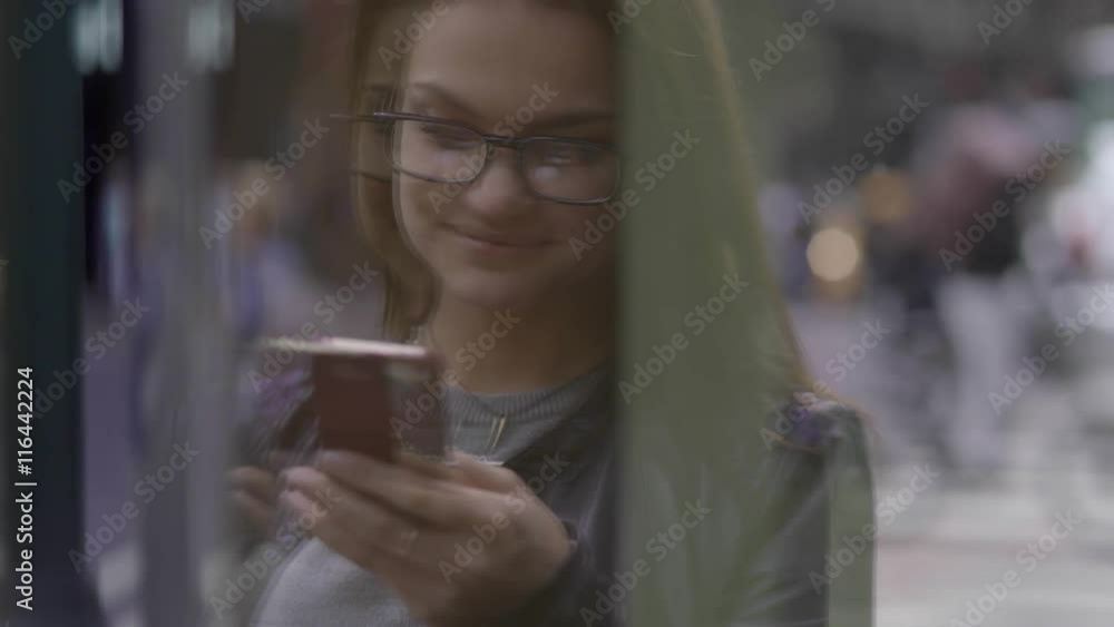 attractive business women using smart phone in the city commuting to work attractive business women using smart phone in the city commuting to work